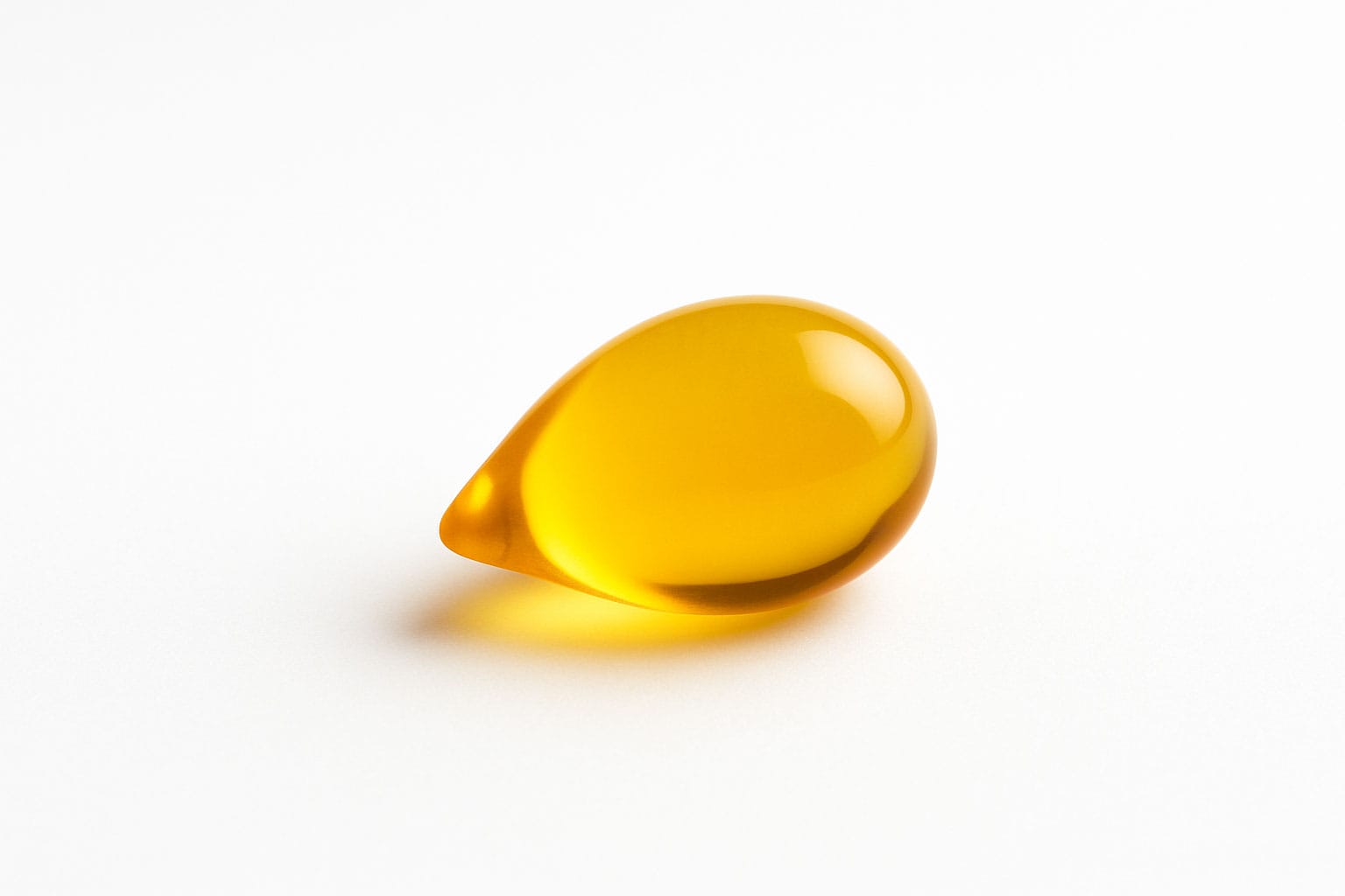 Close-up of Vitamin E on white background, Purecontour.